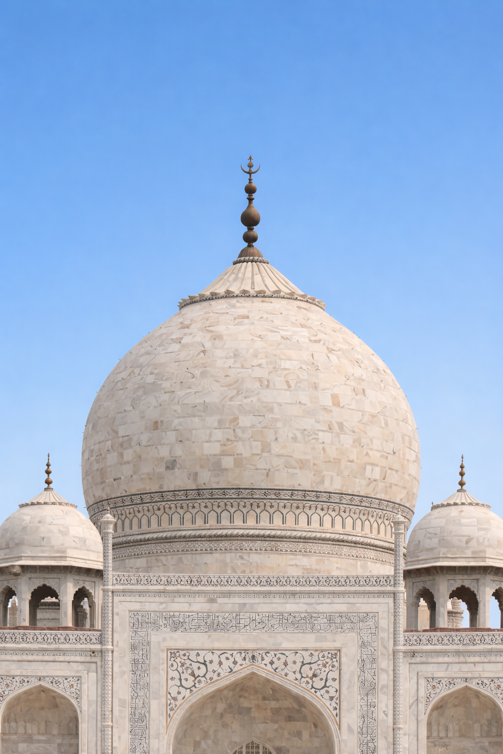 Close view of the central dome and drum with the decorative banding and upper facade detailing.