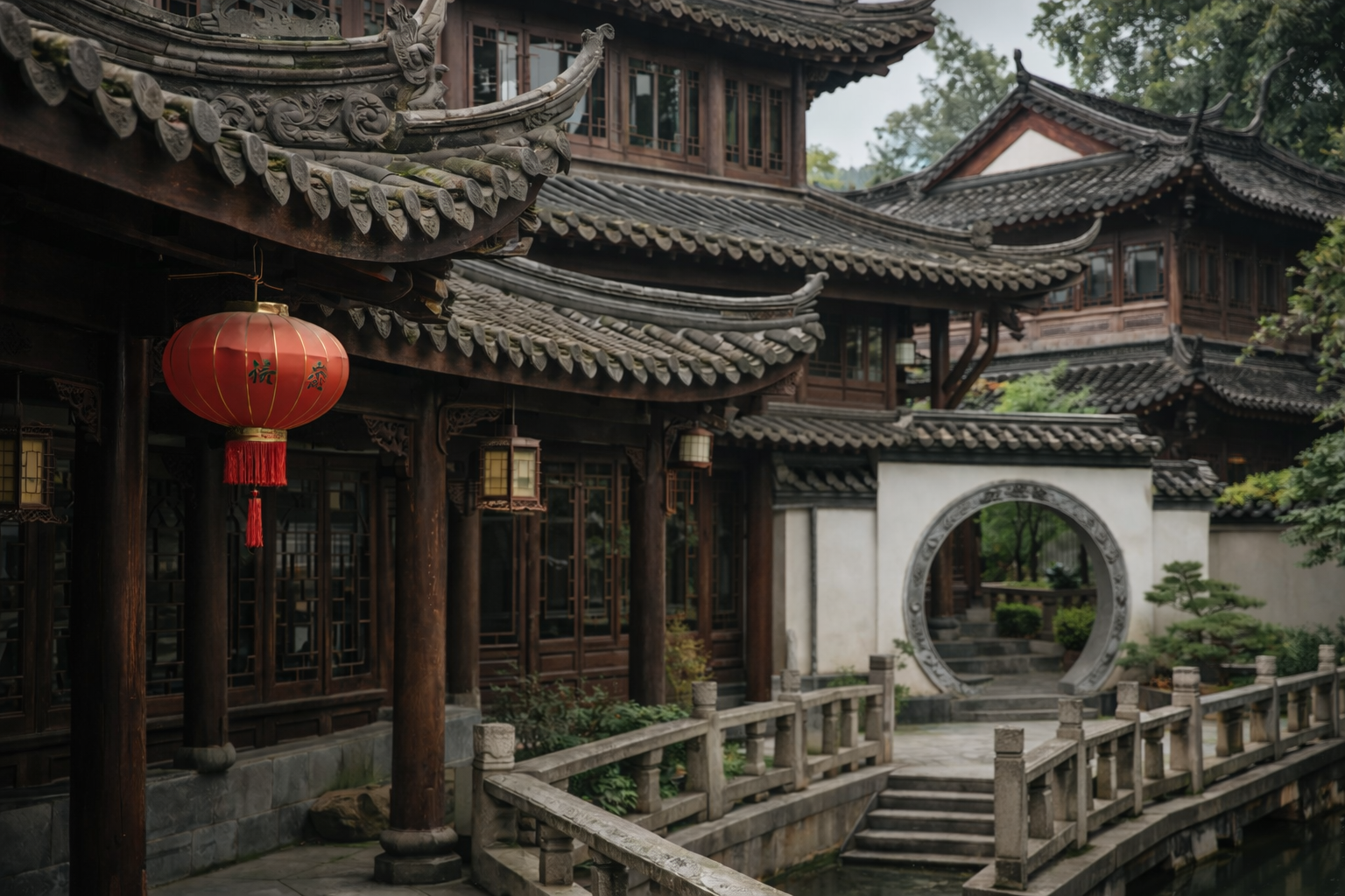 Traditional Chinese house with curved tiled roof, carved woodwork, moon gate, and lantern detail.