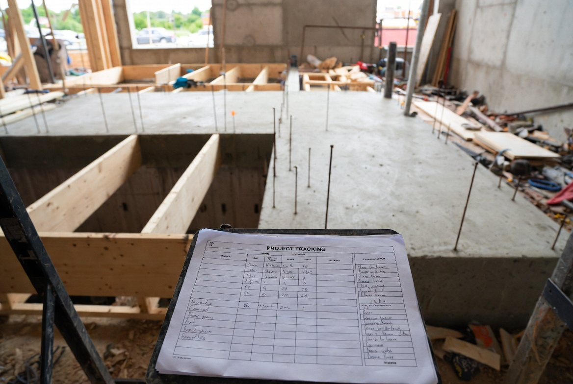 Organized construction tablet and field records showing practical tracking of quantities, inspections, and photos.