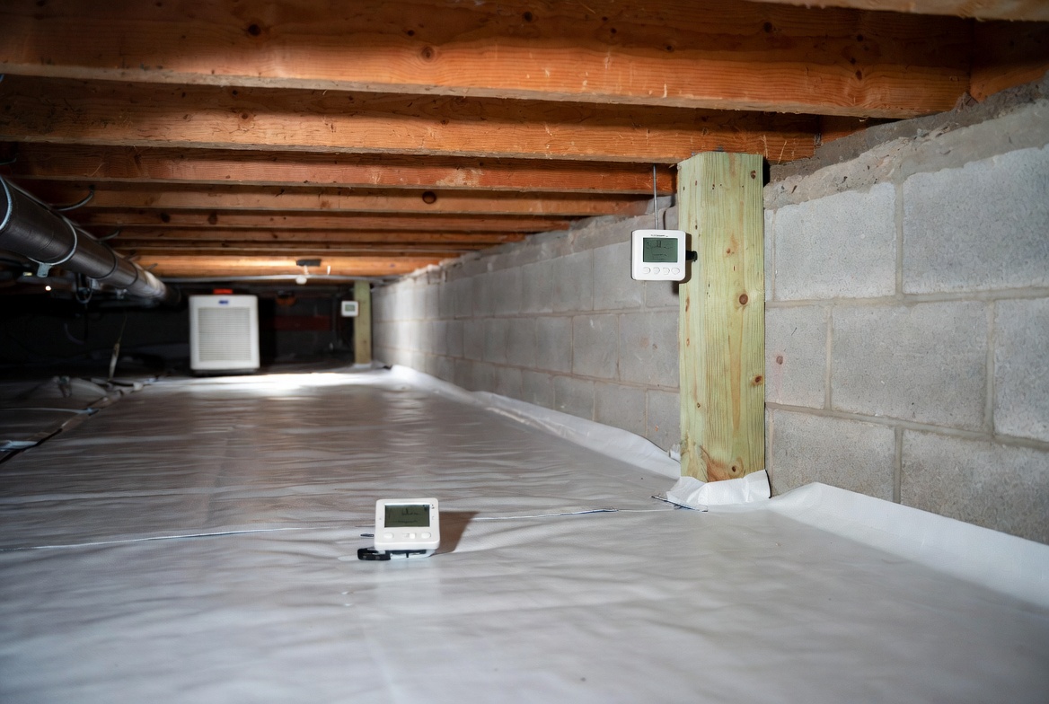 Crawl space hygrometers and humidity monitors placed inside a sealed crawl space.