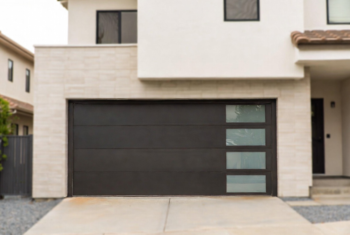 Modern garage door with dark panels, vertical frosted glass inserts, and warm wood trim.