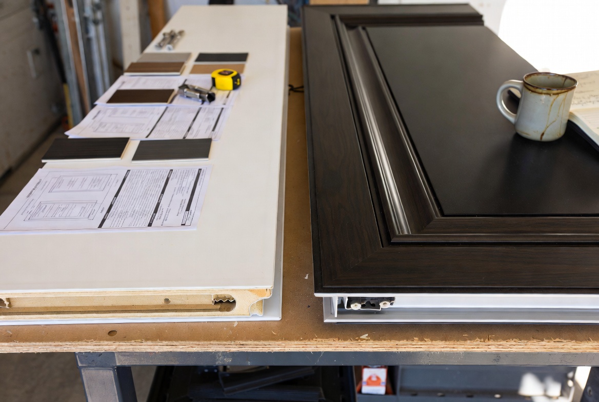 ide-by-side Jeld-Wen vs Masonite exterior door corner samples on a contractor’s worktable.