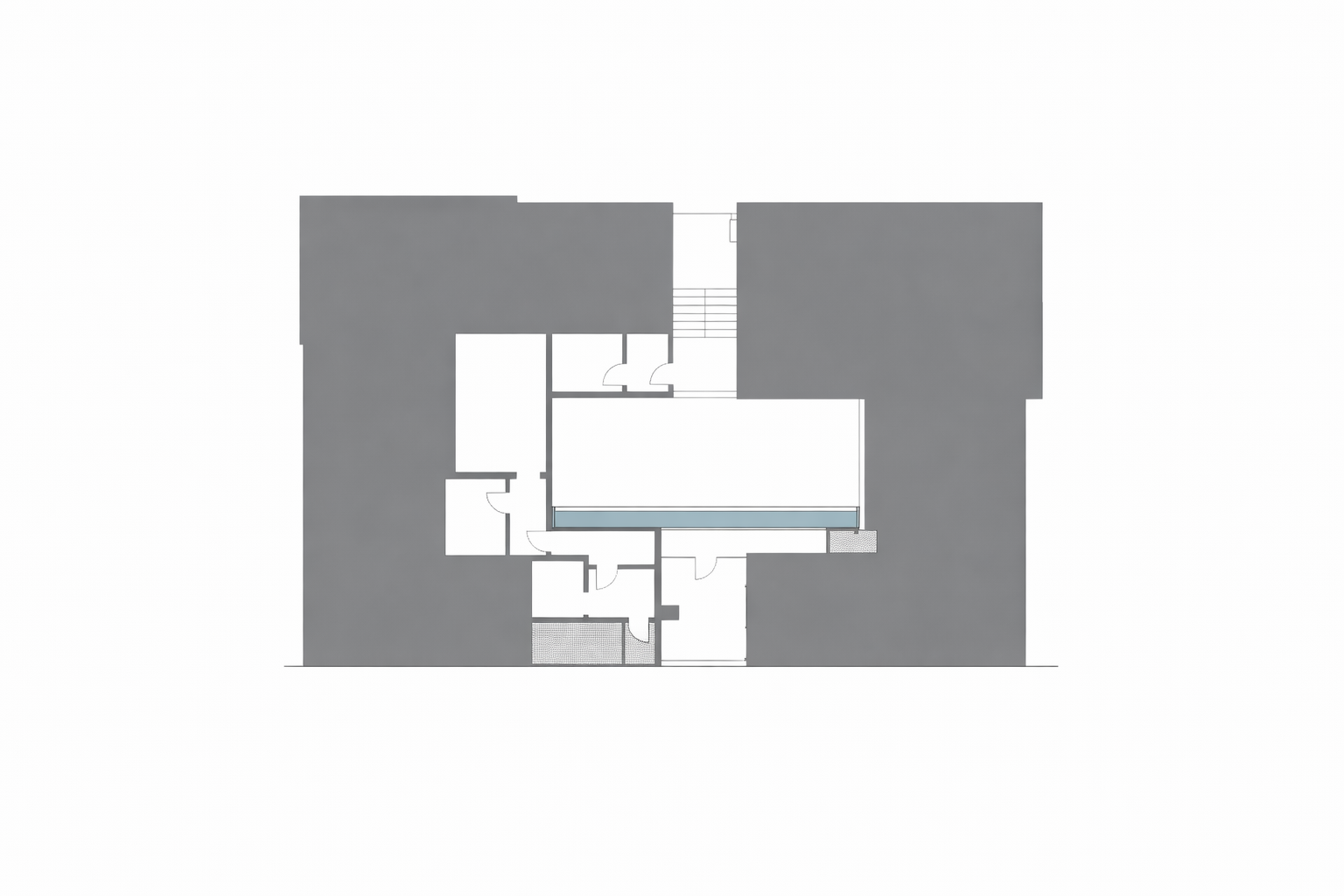 Figure-ground plan showing solid building mass and carved central void in architectural composition.