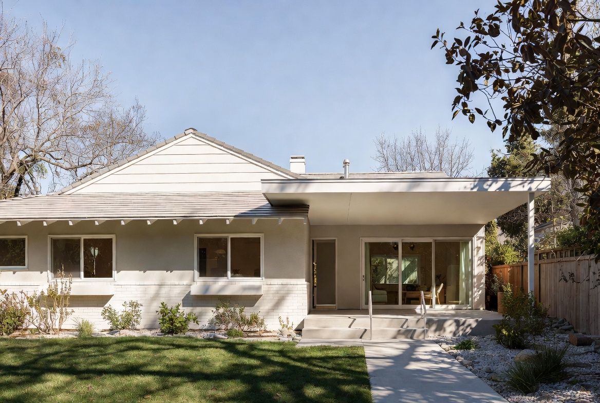 Ranch house with a modest flat-roof entry addition and updated front elevation.