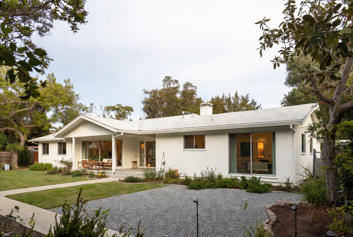 Restrained modern addition to a ranch house with a low porch and balanced front composition.
