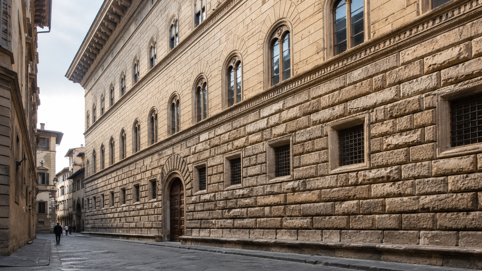 Renaissance urban palace facade on a narrow Italian street with rusticated stone base, ordered upper windows, deep shadows, and small pedestrians for scale.