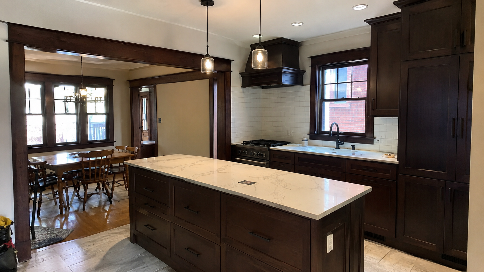 Craftsman kitchen remodel with bulky cabinets, oversized island, and awkward dining room opening.