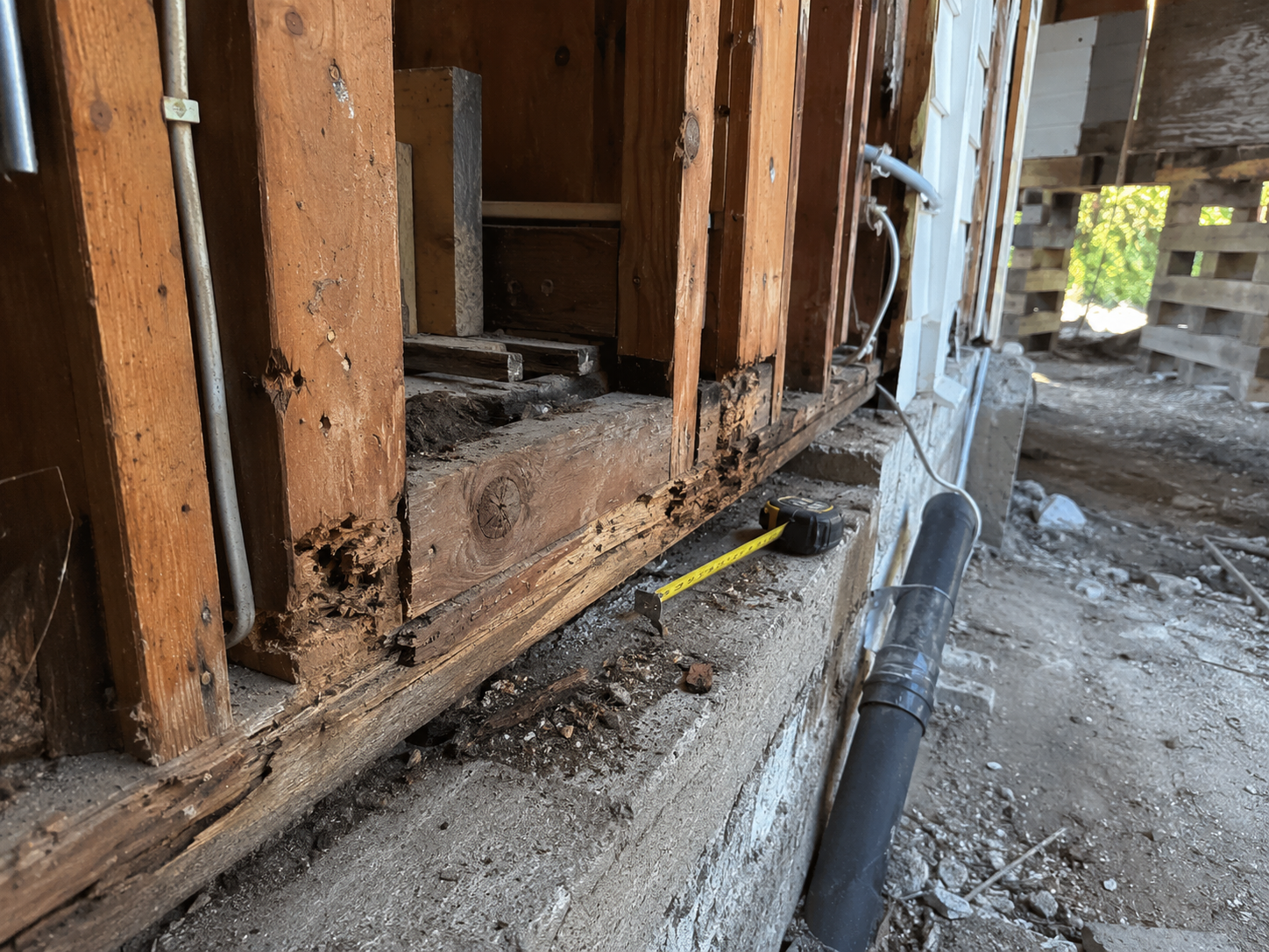 Opened sill and rim joist area found during house raising work.