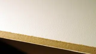 Low density fiberboard sample showing porous texture and lightweight construction.