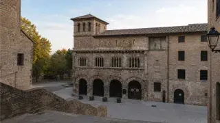 Tower of the Palace of the Kings of Navarre in Olite, Spain, showing medieval stonework, arched openings, and fortified palace architecture.