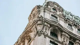 Historic stone building with detailed architecture that has aged beautifully.