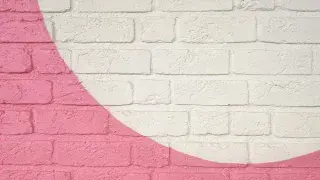 Modern architectural wall built with neatly arranged natural stone.