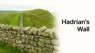 Hadrian’s Wall crossing grassy hills in northern England.