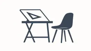A drafting table and chair representing interior design studies.