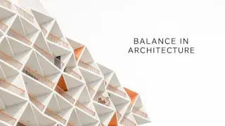 Contemporary building with a geometric design highlighted by triangular balcony shapes.