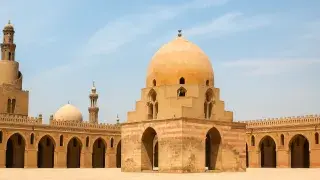 Courtyard of the Mosque of Ibn Tulun in Cairo, viewed from front angle.