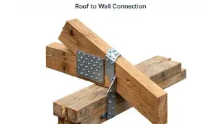 Diagram showing a roof-to-wall framing connection with metal tie hardware and bearing members.