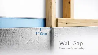 Visual representation of a 1-inch gap between a concrete wall and stud framing, showing foam insulation for moisture control in a basement wall assembly.