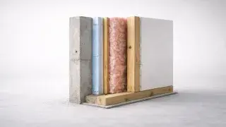 Basement wall cutaway showing concrete, rigid foam, stud wall, batt insulation, and drywall order.