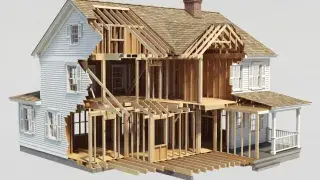 Cutaway wood-framed house showing floor framing, wall studs, roof framing, and structural layout.