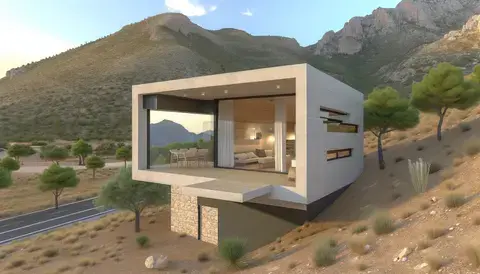 Contemporary casita with panoramic mountain views and a cantilevered terrace.