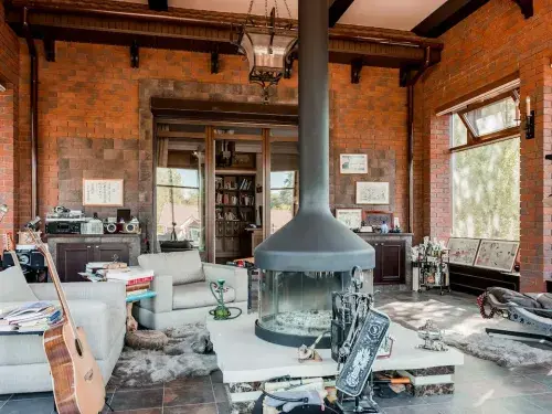 living room with leather armchairs and hammock chair