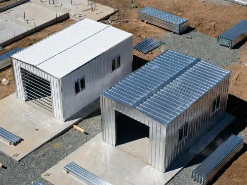 Two small prefab metal buildings under construction showing different shell types and price scope.