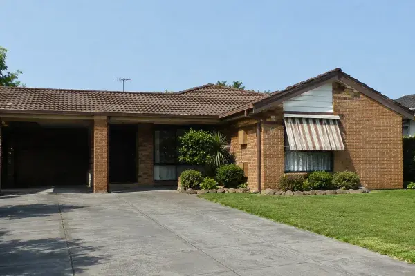 Close-up of a renovated 1980s suburban brick house.